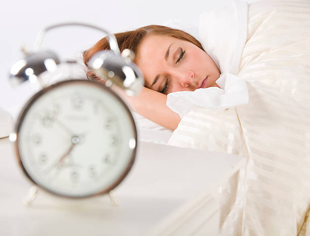 istock Young Woman in a White Bedroom 121872062