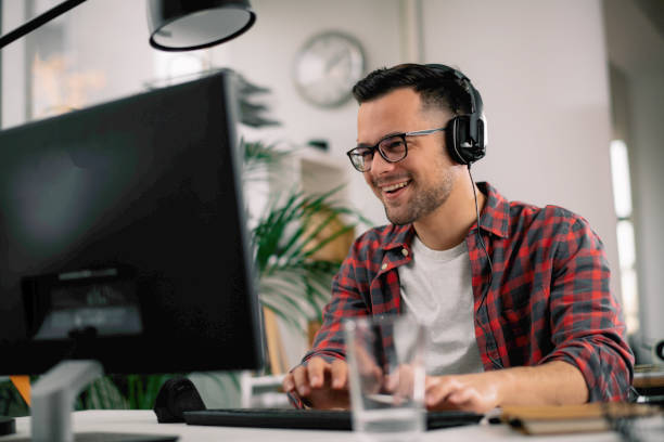 istock Young businessman have fun while working in office. 1218721100