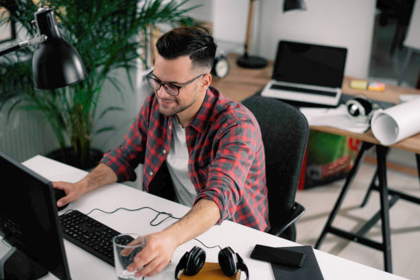 istock Young businessman have fun while working in office. 1218721197