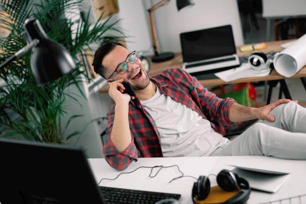 istock Young businessman have fun while working in office. 1218721235