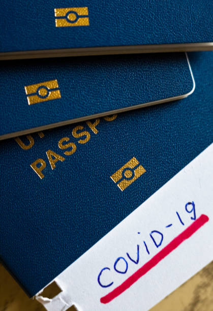 istock Passport and note with Covid-19 inscription. 1218721568