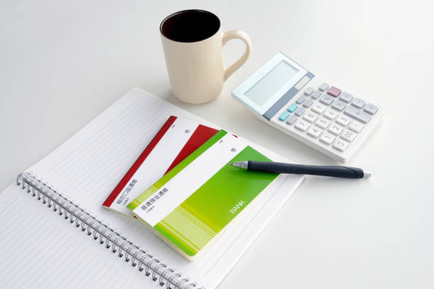 istock Japanese passbook and calculator on table 1218722159