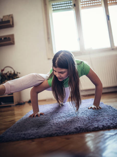 istock kids exercising at home  -covid 19 1218723646