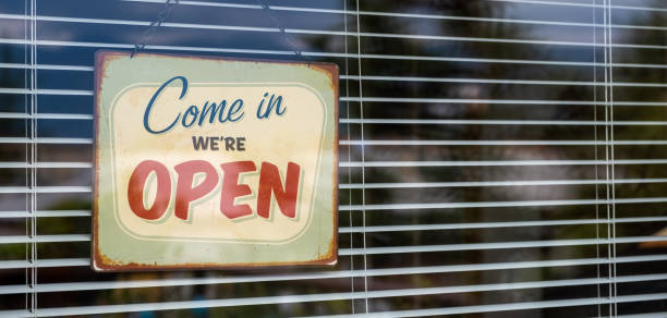 Come in we're OPEN sign on Entrance Window