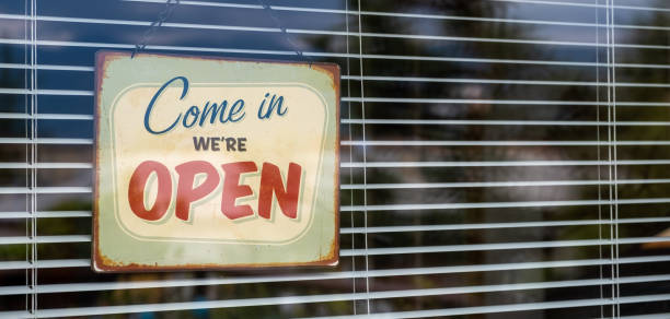 Come in we're OPEN sign on Entrance Window Come in we're OPEN sign on Entrance Window reopening photos stock pictures, royalty-free photos & images