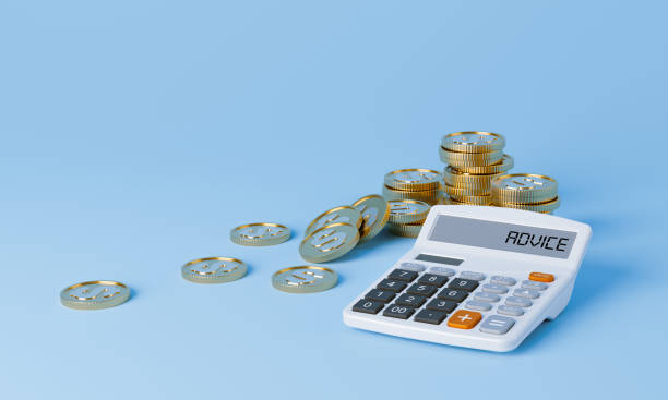 Calculator and Gold Coins. stock photo