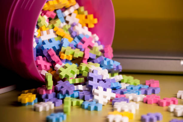istock Colored toy constructions that come out of a container 1218726463