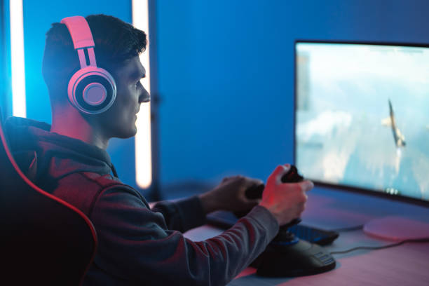 istock The young gamer playing online video game on his personal computer 1218726575