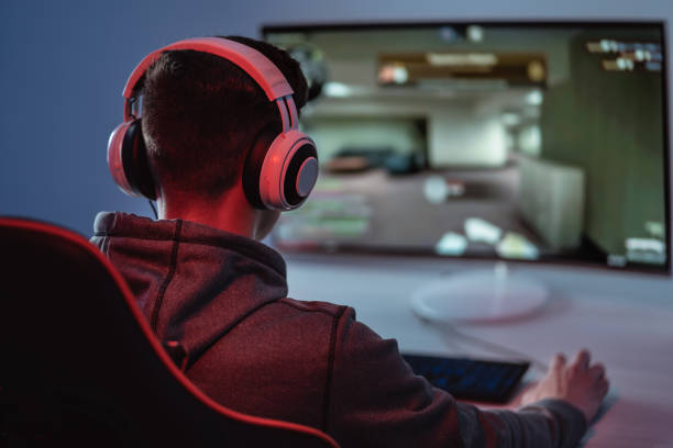 istock The gamer playing video game on his personal computer 1218726584