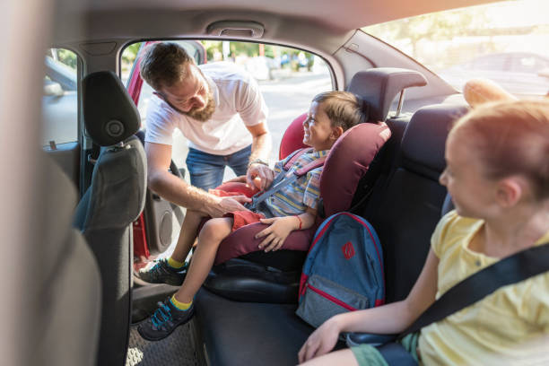 istock Father preparing his kids for a car trip 1218726861