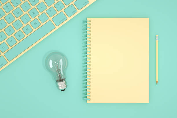 istock Top View of Workplace with Keyboard and Spiral Notebook, Technology Idea Concept 1218727974