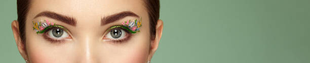 Female eye with flower makeup eyes
