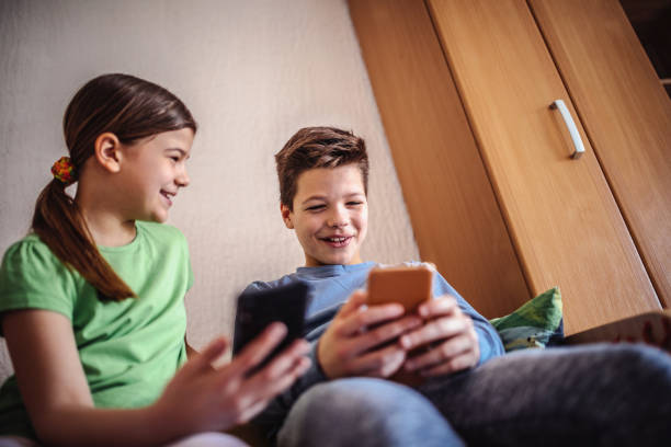 istock Child using smartphone for distance online studying- COVID-19 1218729664