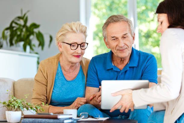 istock Senior couple having meeting with financial advisor 1218730298