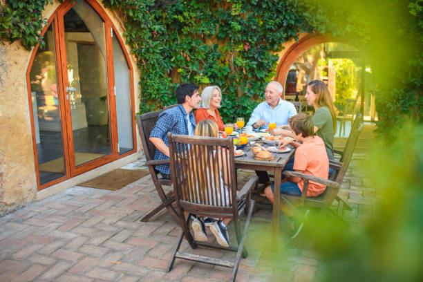 istock Spanish Family Enjoying Outdoor Breakfast on Weekend 1218730353
