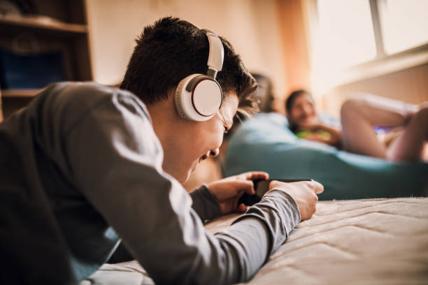 istock Child using smartphone for distance online studying- COVID-19 1218731153