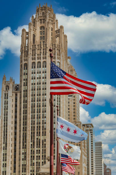 istock American and Chicago Flags by Chicago Tower 1218731328