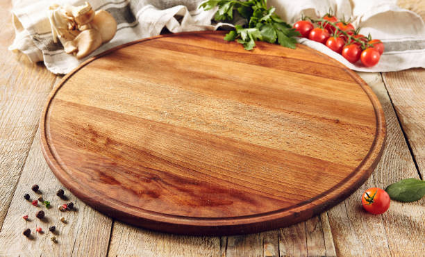 istock Cutting board on wooden surface 1218731740