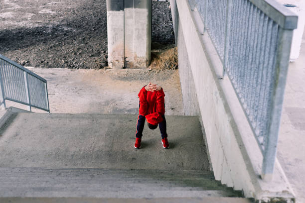 istock Young runner stretching and warming up for running. Urban life scenery. 1218731932
