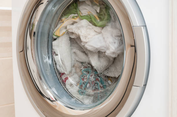 istock Wash clothes in washing machine close up 1218732589