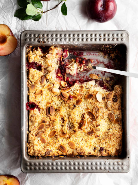 istock Plums crumble pie, crumble, fruit crumble,Crumble with plum, Crumble with Plums and nuts on a white background, Sweet 1218734829