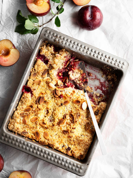 istock Plums crumble pie, crumble, fruit crumble,Crumble with plum, Crumble with Plums and nuts on a white background, Sweet 1218735124