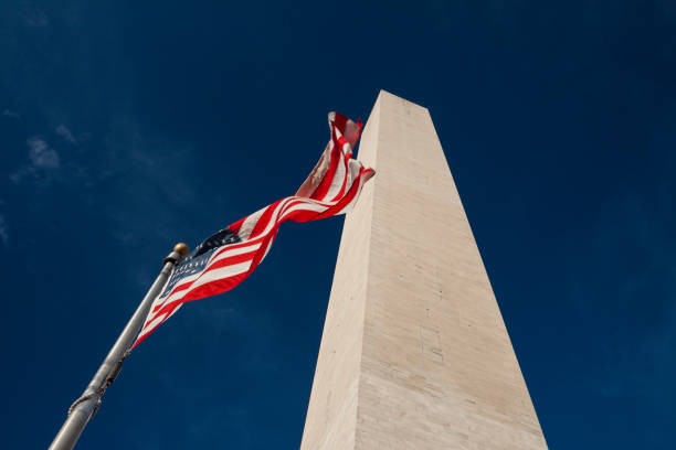 istock Washington Monument with US flag. Washington, USA 1218736777
