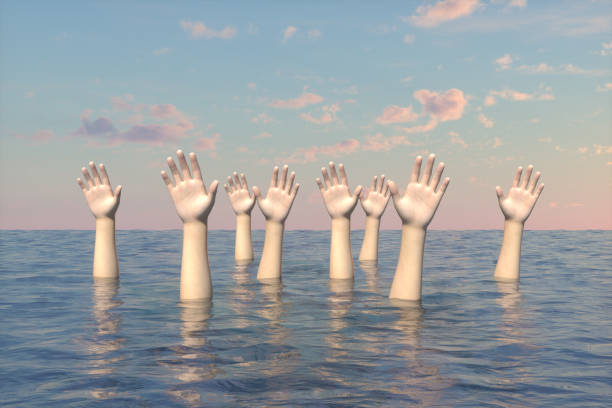 istock Hand of sinking people on the sea 1218737909
