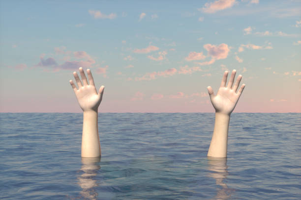 istock Hand of sinking man on the sea 1218737957