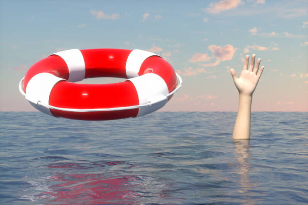 istock Saving drowning man with lifebuoy, rescue concept. 1218738016
