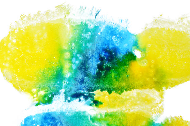 istock yellow, green and blue flow over a white background. Watercolor abstraction. 1218738624