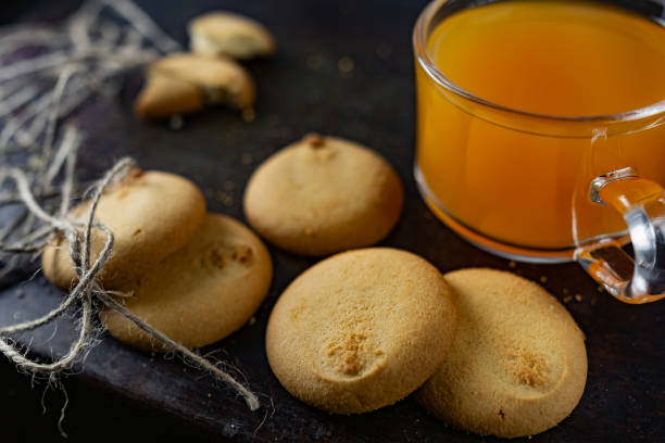 istock Homemade shortbread, round-shaped pastry on a dark old surface in a stack of crumbs. 1218739509