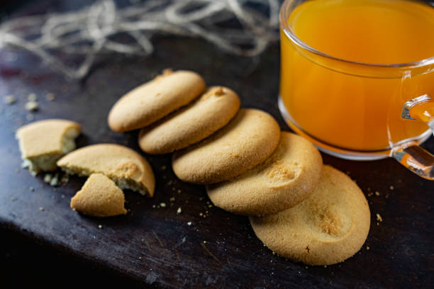 istock Homemade shortbread, round-shaped pastry on a dark old surface in a stack of crumbs. 1218739533