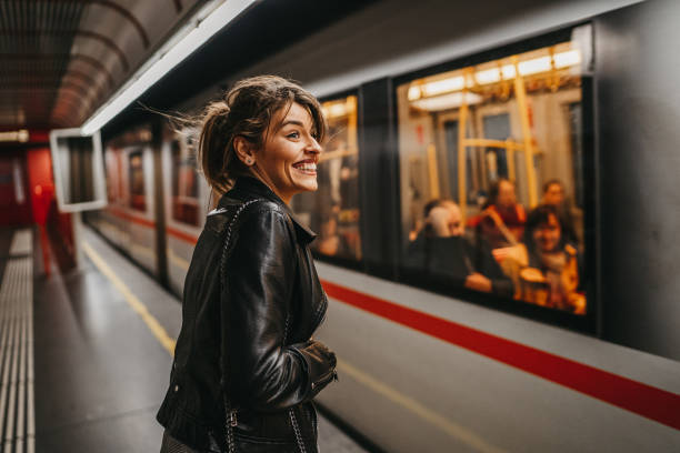 istock Woman waiting at the train platform 1218739896