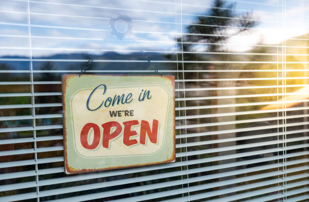 istock Come in we're OPEN sign on Entrance Window 1218740419