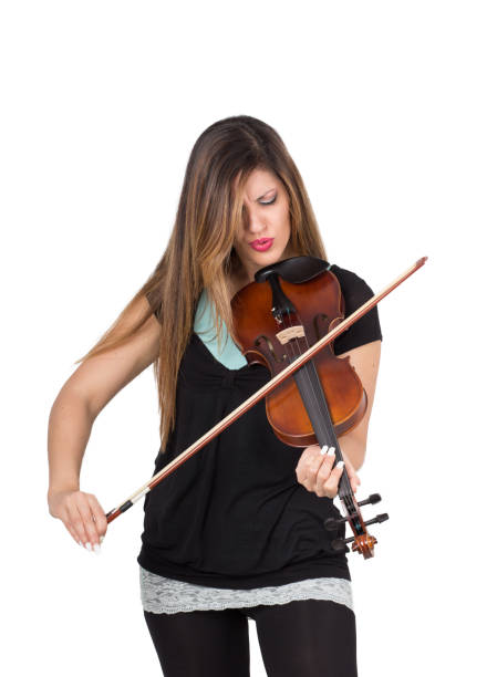 istock beautiful woman play her violin 1218741118