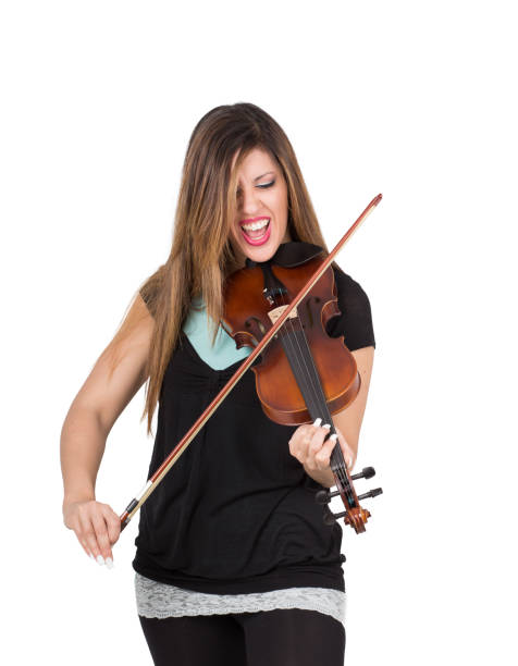 istock beautiful woman play her violin 1218741119