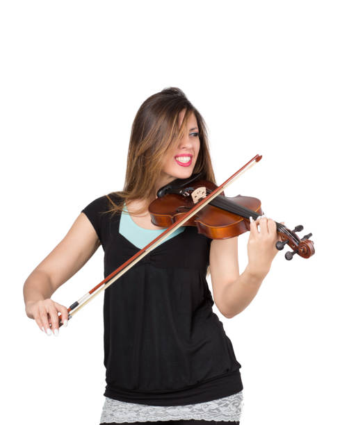 istock beautiful woman play her violin 1218741136