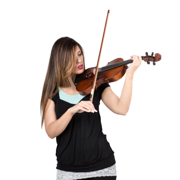 istock beautiful woman play her violin 1218741141