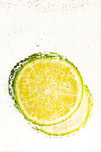 Lime slices in sparkling soda water