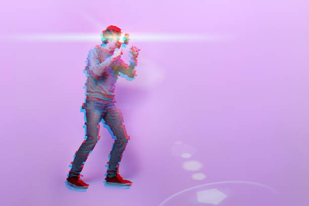 istock Man with virtual reality headset is playing game and fighting. Image with glitch effect. 1218744036
