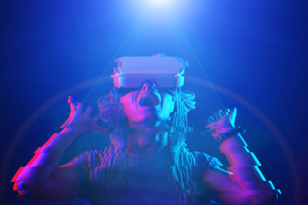 istock Woman is using virtual reality headset. Neon light studio portrait. Image with glitch effect. 1218744925