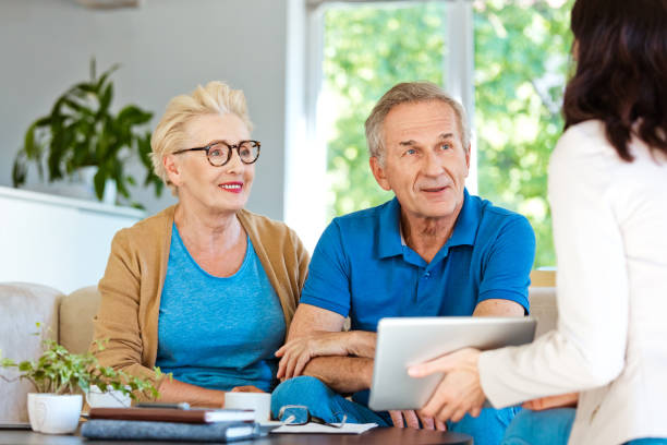 istock Senior couple having meeting with financial advisor 1218745188
