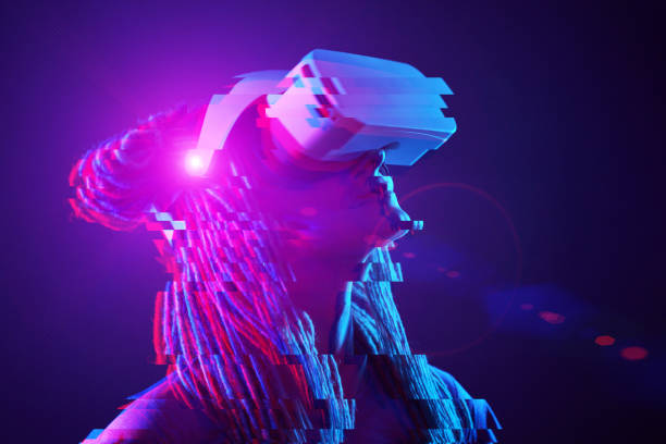 istock Woman is using virtual reality headset. Neon light studio portrait. Image with glitch effect. 1218745612