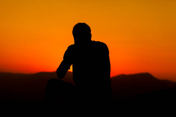 istock silhouette of man at sunset 1218746314