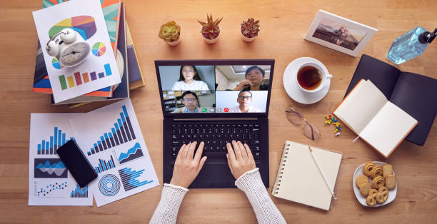 istock work from home. people make video conference with multi colleague via laptop computer during self isolation to avoid spreading illness transmission of COVID-19 Coronavirus outbreak. Social distancing 1218746751