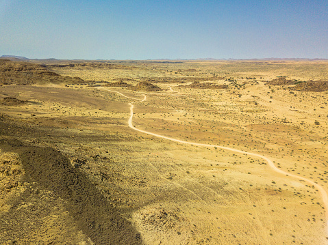 Aerial view: a gravel road through the Fish River Canyon, Namibia
