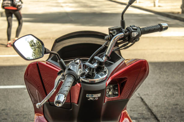 istock red motorcycle handlebar parked on the street 1218748468