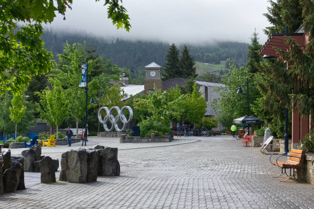 Whistler, BC, Canada - June 4, 2018. Olympic rings at Olympic Plaza on a rainy summer day. Whistler was the Host Mountain Resort of the Vancouver 2010 Winter Olympics and Paralympic Games,