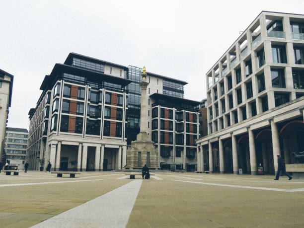 London Lockdown - Empty City lunchtime in the  City London / UK - March 19th 2020: Paternoster Square by The London Stock Exchange, City of London which is normally busy at lunchtime is deserted as people work from home during the COVID-19 coronavirus paternoster square stock pictures, royalty-free photos & images